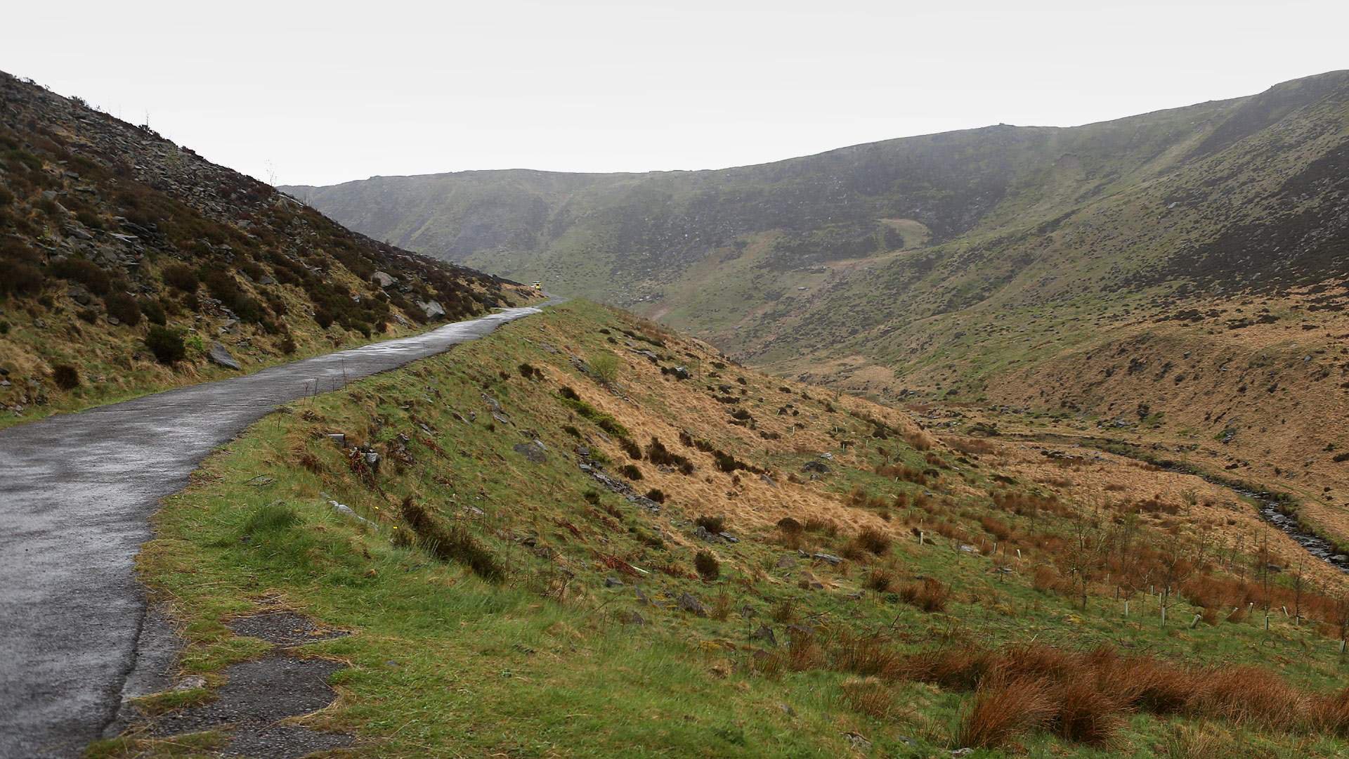 View of empty moors with road leading into the distance